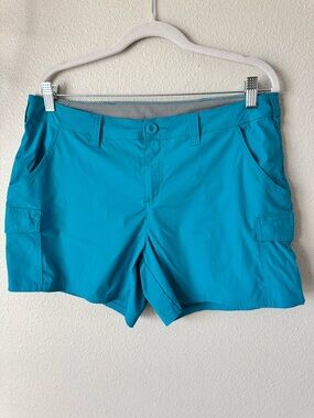 Women's Teal Performance Cargo Shorts by Worldwide Sportsman.